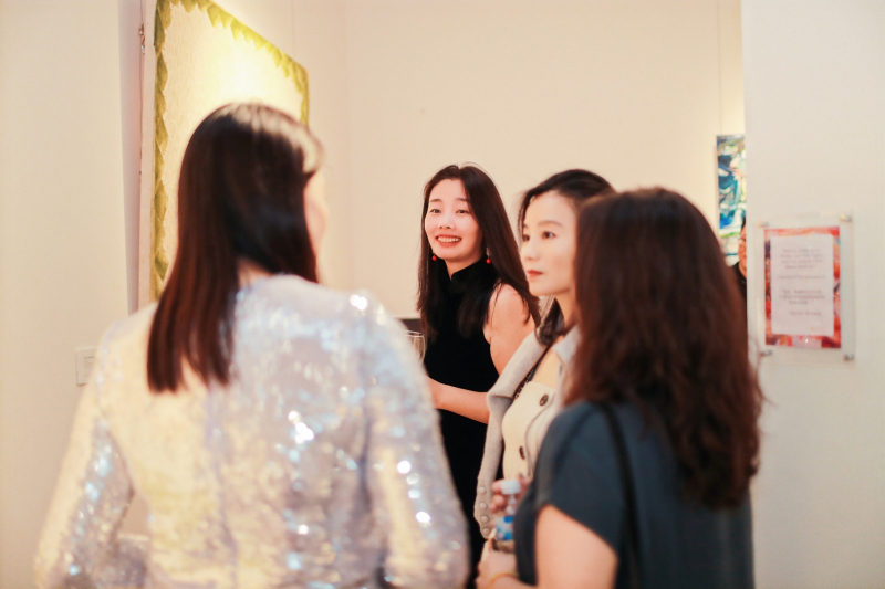 the gallery owner conducts guided tours for the guests